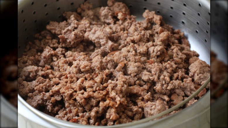 ground beef in strainer
