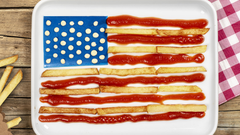 Top-down of a white plate of fries with with ketchup and mayonnaise used as the USA flag