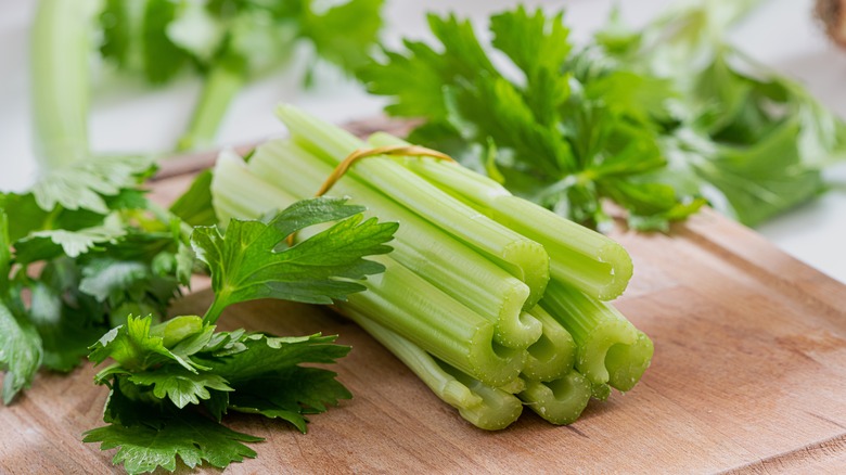 celery on wooden cutting board